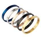 Brazalete cristiano Rígido Padre Nuestro en Acero Inoxidable con Cruz