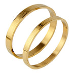 Brazalete cristiano Rígido Padre Nuestro en Acero Inoxidable con Cruz