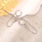 Pendientes a clip con cruz e incrustación de zirconia – Asimétricos para mujer