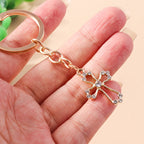 Llavero de Cruz con Cristales Brillantes - Accesorio de Fe Cristiano en Tono Dorado