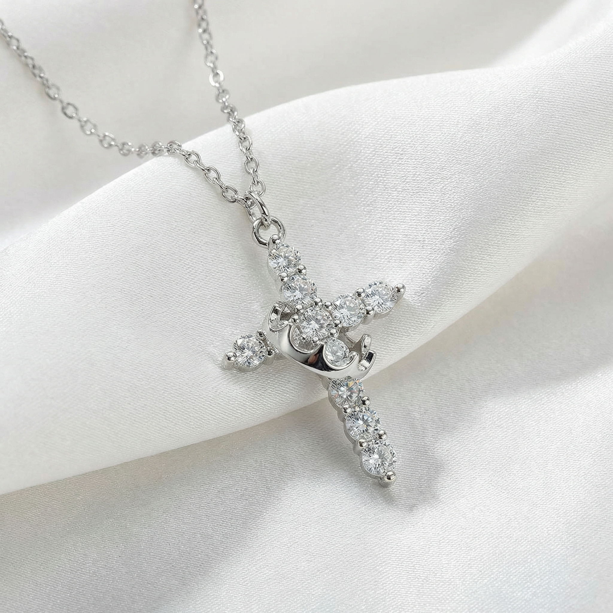 Conjunto Cruz y corona giratoria color PLATA